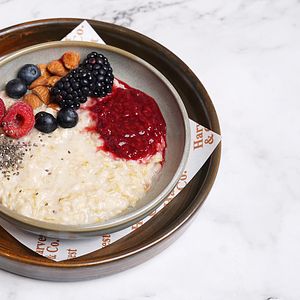 PORRIDGE WITH BERRY COMPOTE & CHIA ALMOND & CREAM